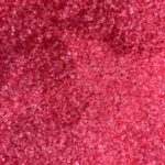 Barbe à papa artisanale colorée, préparée avec des sucres faits maison pour un anniversaire à thème.
